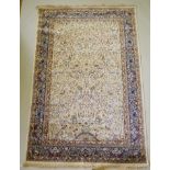 An ivory ground Kashmir full pile rug with tree of life design with blue borders, 158 x 234cm