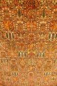 A Persian Bakhtiar multi-colour ground carpet, with Persian panel design, 335 x 250cm