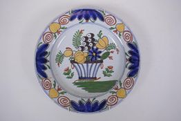 An C18th/C19th Delft cabinet dish with floral decoration, mark to base, AF, 24cm diameter
