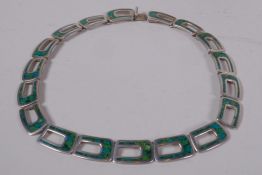 A Mexican Native American silver necklace inset with turquoise stones, marked TM-20