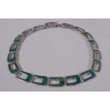 A Mexican Native American silver necklace inset with turquoise stones, marked TM-20