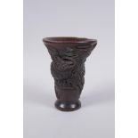 A Chinese faux horn libation cup with raised phoenix  decoration, 13cm high