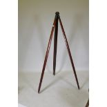 A C19th mahogany surveyor's tripod/camera stand, with bronze mounts and swivel head, 143cm long