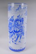 A Chinese blue and white porcelain stick stand decorated with warriors on horseback, 62cm high x