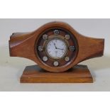 A vintage wood propeller hub, fitted with a Smiths clock, 24cm high, 37cm wide
