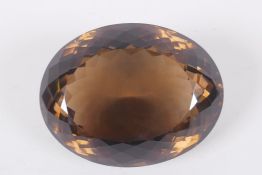 A large honey topaz gemstone, faceted oval cut, loose, 8.5 x 7cm