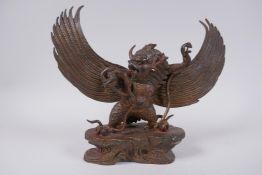 A Tibetan gilt bronze Garuda, 31cm wide