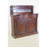 A Victorian mahogany serpentine front chiffonier, with mirrored back under a shelf, single frieze