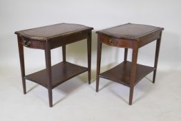 A pair of mahogany end tables with a single drawer, leather inset tops, tapered legs and an under