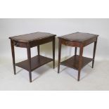 A pair of mahogany end tables with a single drawer, leather inset tops, tapered legs and an under