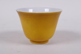 A yellow ground porcelain tea bowl, Chinese KangXi 6 character mark to base, 5cm high x 7cm diameter