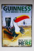 A vintage style metal Guinness advertising sign, 50 x 70cm