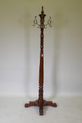 A Harrods Victorian style mahogany coat stand, with revolving brass hooks, 175cm high