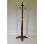 A Harrods Victorian style mahogany coat stand, with revolving brass hooks, 175cm high