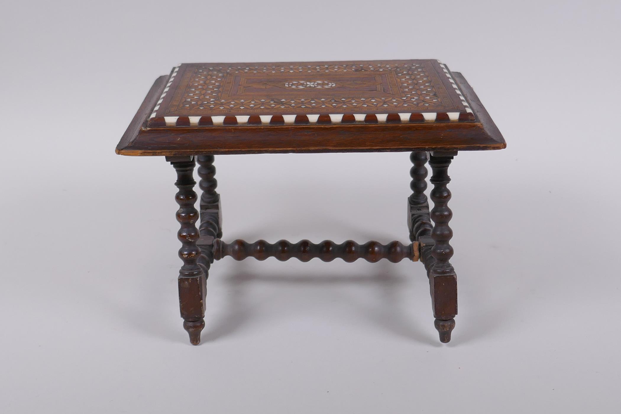 An antique mahogany stand in the form of a table, with sadeli inlaid decoration to top and turned - Image 3 of 3