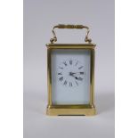 An early C20th French brass cased carriage clock, the enamel dial with Roman numerals, the