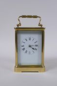 An early C20th French brass cased carriage clock, the enamel dial with Roman numerals, the