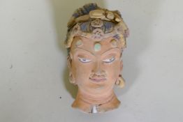 A Ghandar style painted clay head, 14cm high