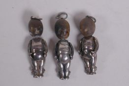 Three silver Fumsup touch wud pendant charms, 3cm long