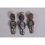 Three silver Fumsup touch wud pendant charms, 3cm long