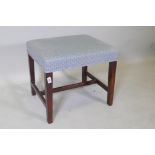 A C19th mahogany stool, raised on square tapering supports united by an H stretcher, 51 x 44 x 46cm