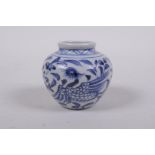 An early Chinese miniature blue and white porcelain pot with phoenix decoration, possibly Yuan