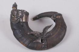 An antique 925 silver mounted goat powder horn with eagle decoration, 13cm long