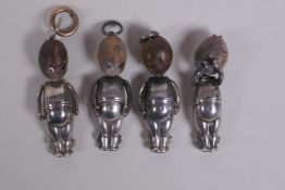 A Fumsup touch wud silver charm, Reg 636612, 3cm long, and three others