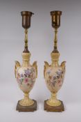 A pair of continental porcelain urn shaped table lamps with gilt metal mounts and polychrome