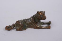 A Japanese bronze okimono tiger, mark to base, 9cm long