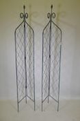 A pair of wrought iron folding two sided garden trellises, 215cm high