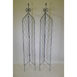 A pair of wrought iron folding two sided garden trellises, 215cm high