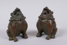 A pair of Japanese censers and covers in the form of temple lions, marks to base, 7cm high