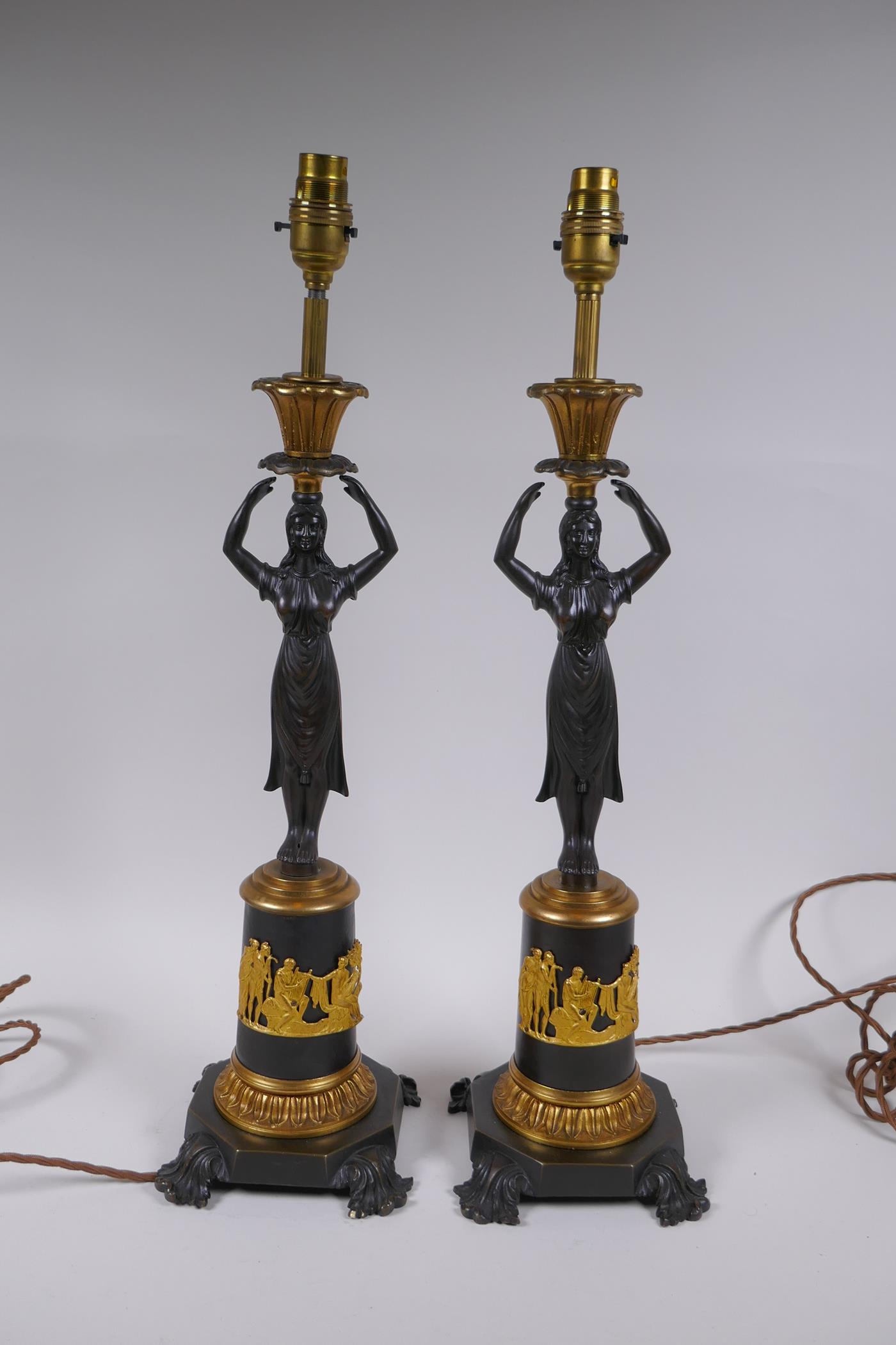 A pair of bronze and ormolu figural lamps, 54cm high