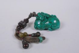 A Chinese imitation turquoise kylin pendant/toggle, 7cm long
