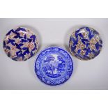A pair of C19th transfer decorated plates in the Imari palette and a blue and white cake plate