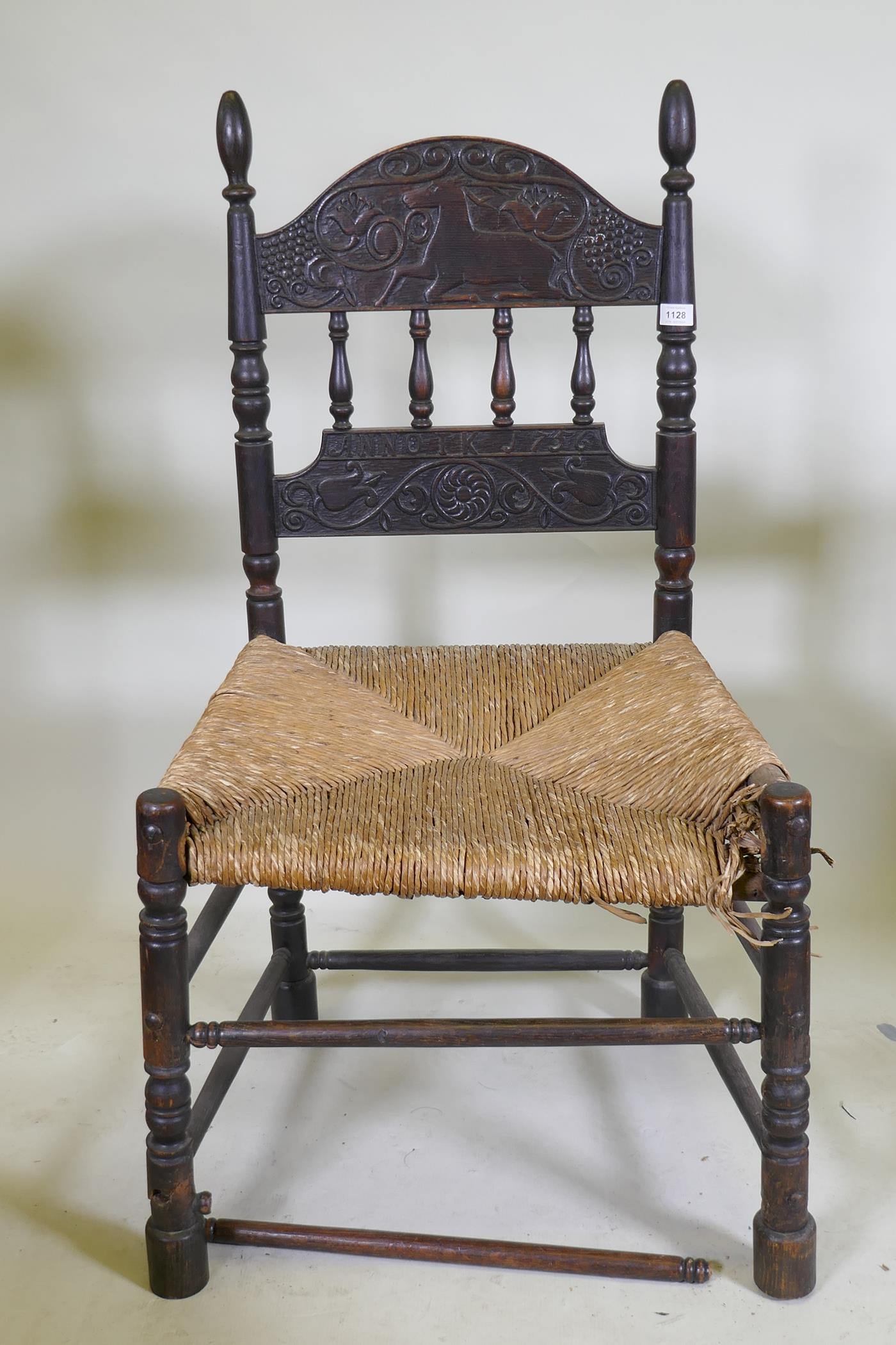 An C18th continental oak side chair, the back carved with a leaping stag and inscribed ANNO TK 1756, - Image 3 of 8