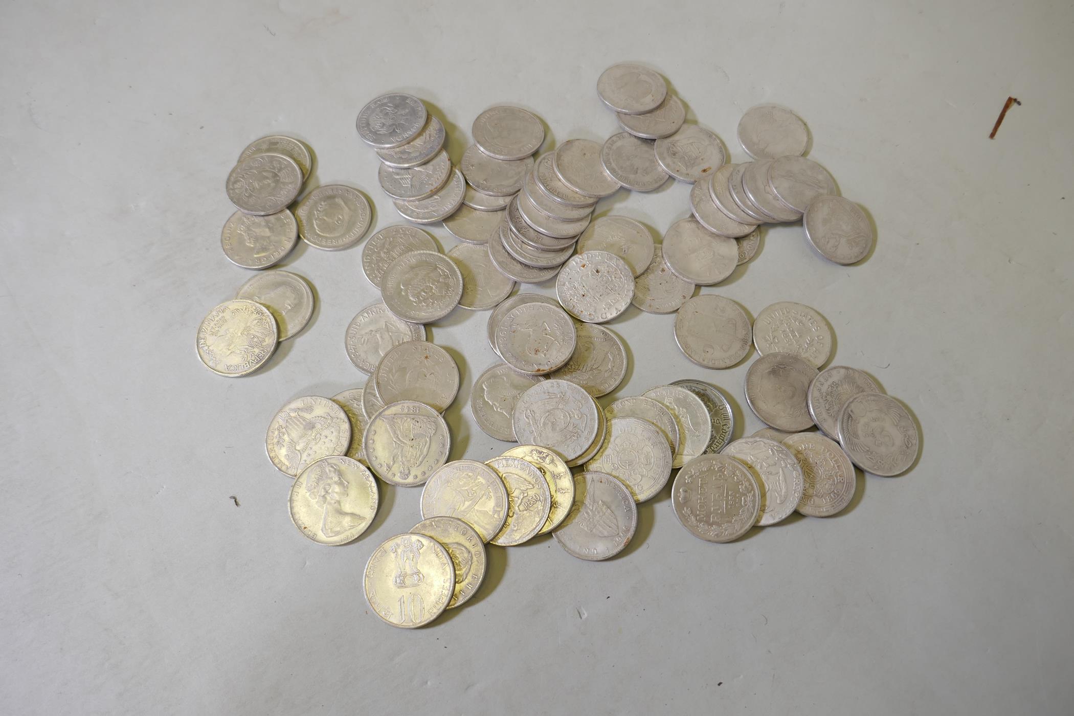 A quantity of replica white metal world silver coins