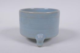 A Chinese Ru ware style porcelain cylinder censer on tripod supports, 10cm diameter