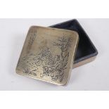 A Japanese white metal ink box, with engraved decoration to the cover depicting fishermen, impressed