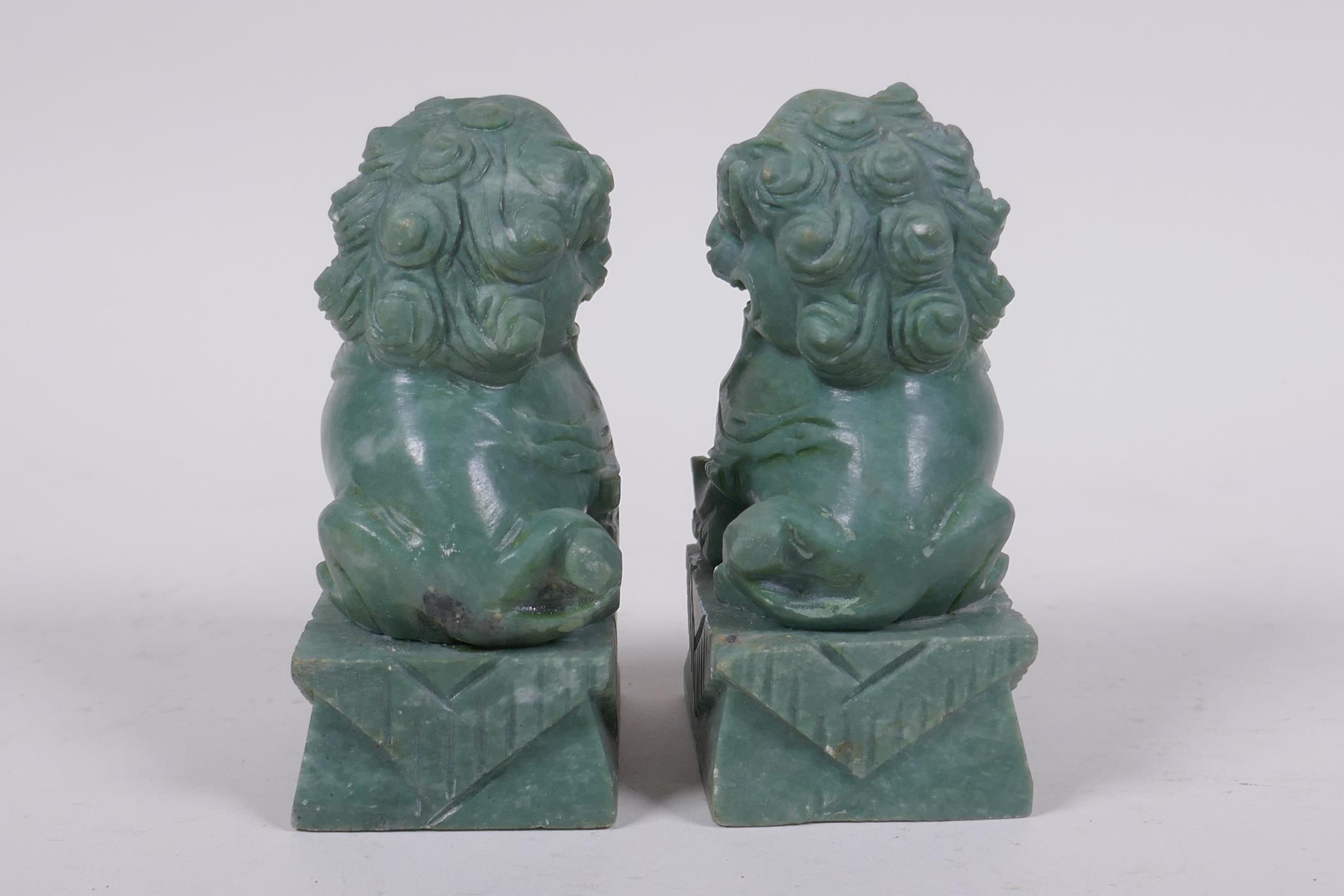 A pair of Chinese carved green soapstone temple lions, 10cm high - Image 3 of 6