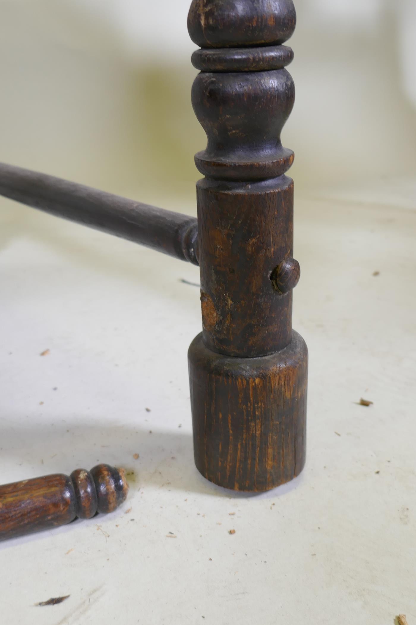 An C18th continental oak side chair, the back carved with a leaping stag and inscribed ANNO TK 1756, - Image 7 of 8