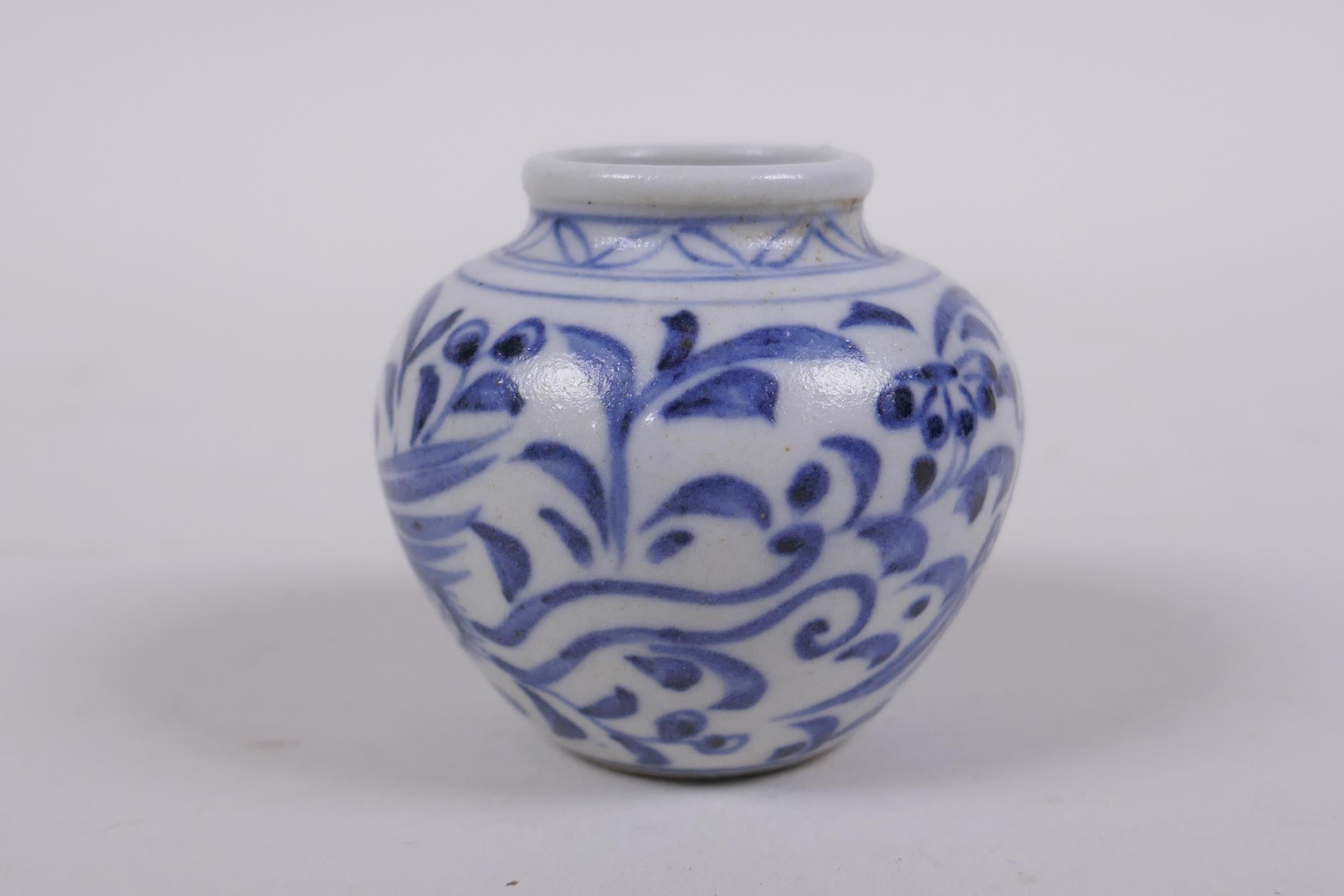 An early Chinese miniature blue and white porcelain pot with phoenix decoration, possibly Yuan - Image 2 of 5