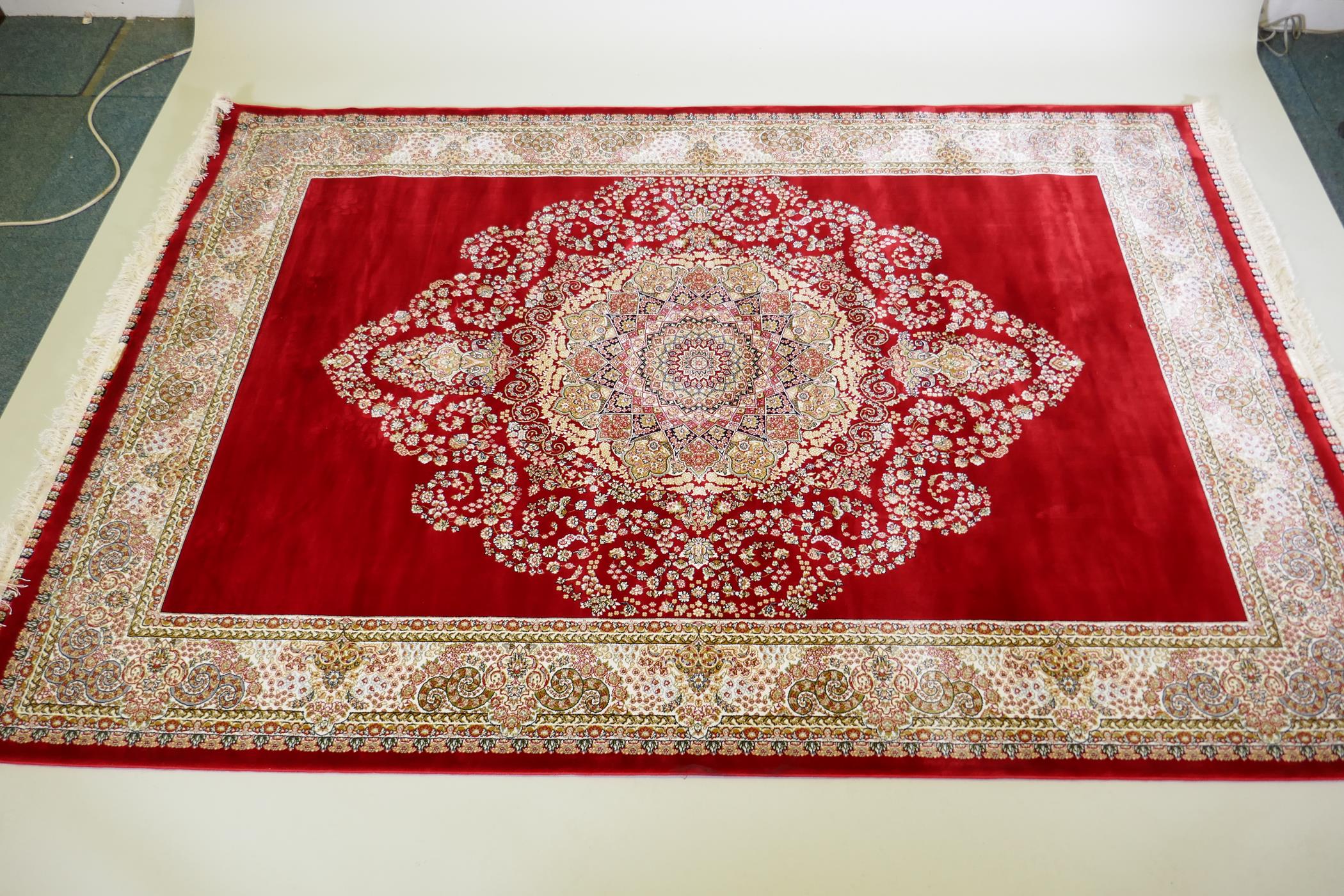 A rich ruby red ground full pile Qum rug with floral medallion pattern, 158 x 234cm - Image 2 of 7