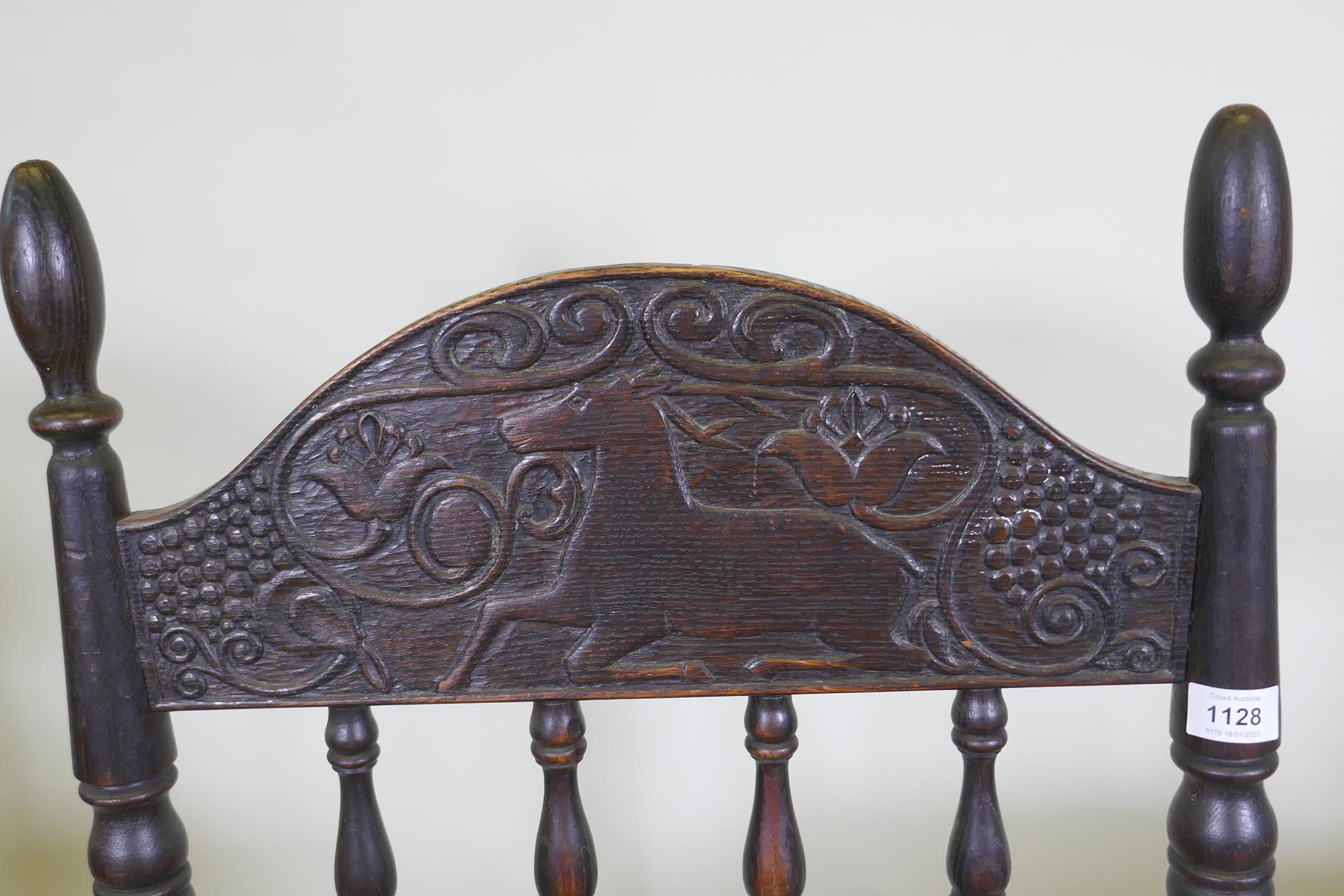 An C18th continental oak side chair, the back carved with a leaping stag and inscribed ANNO TK 1756, - Image 4 of 8