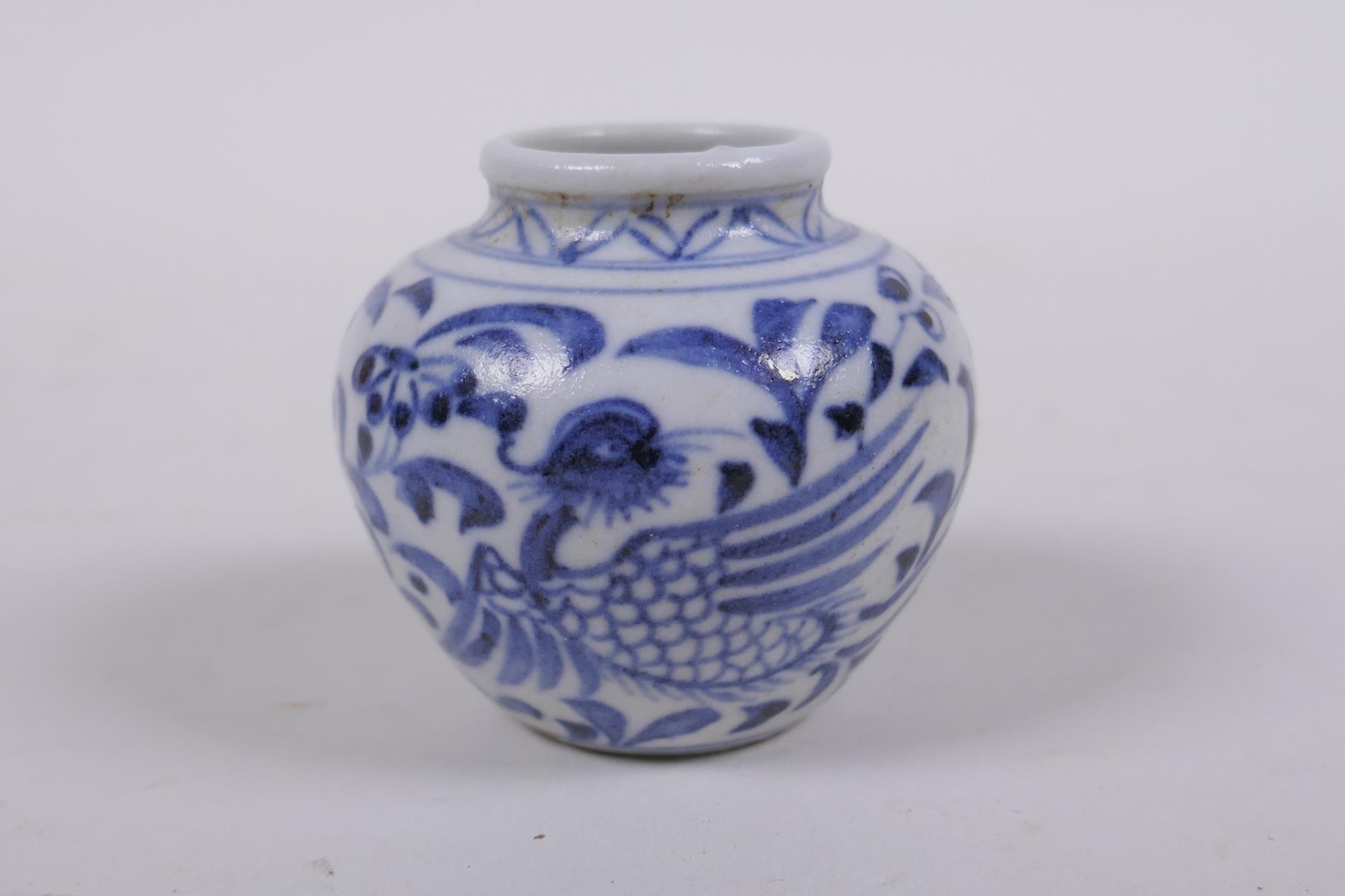 An early Chinese miniature blue and white porcelain pot with phoenix decoration, possibly Yuan - Image 3 of 5