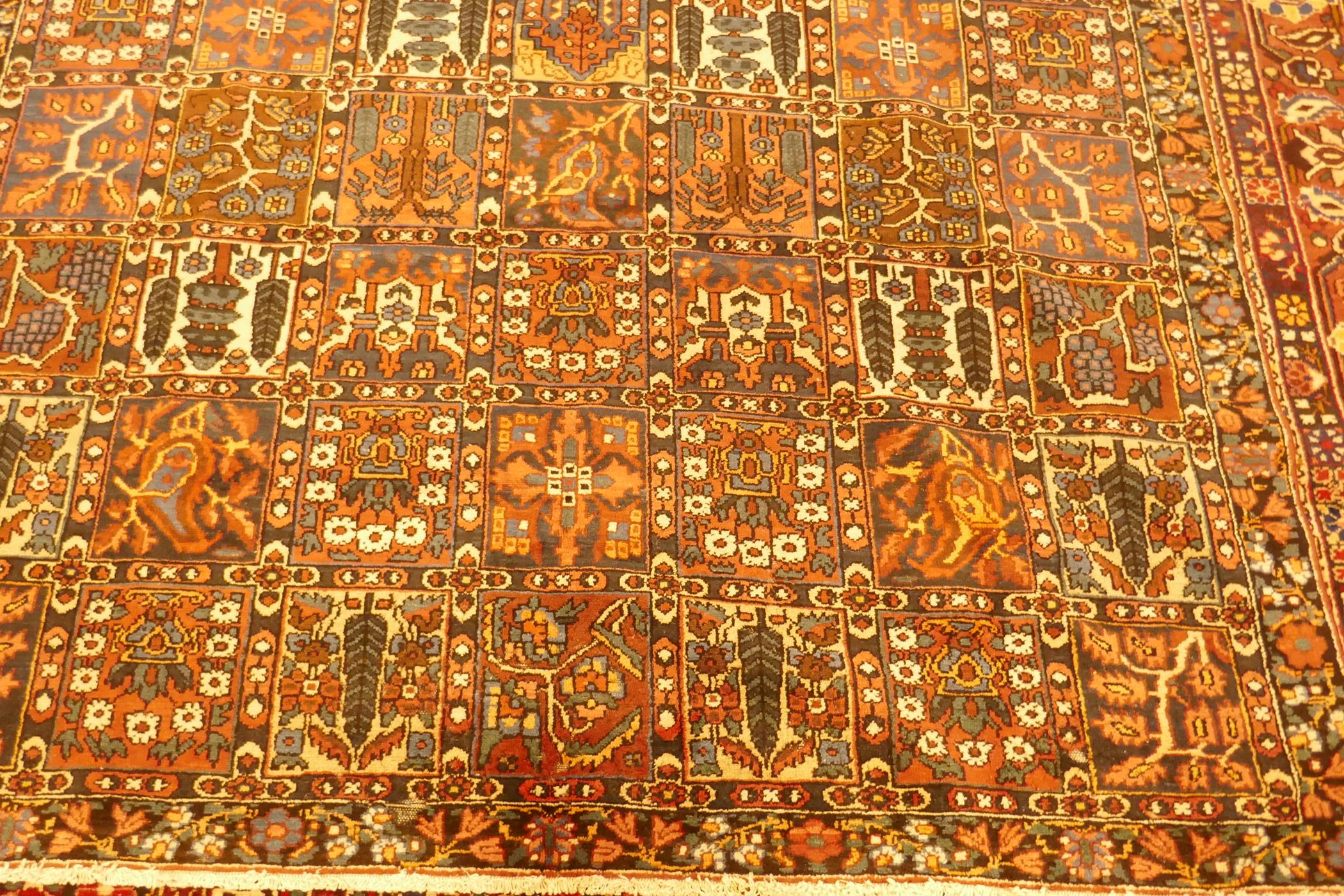 A Persian Bakhtiar multi-colour ground carpet, with Persian panel design, 335 x 250cm - Image 3 of 3
