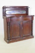 A Victorian mahogany serpentine front chiffonier, with mirrored back under a shelf, single frieze