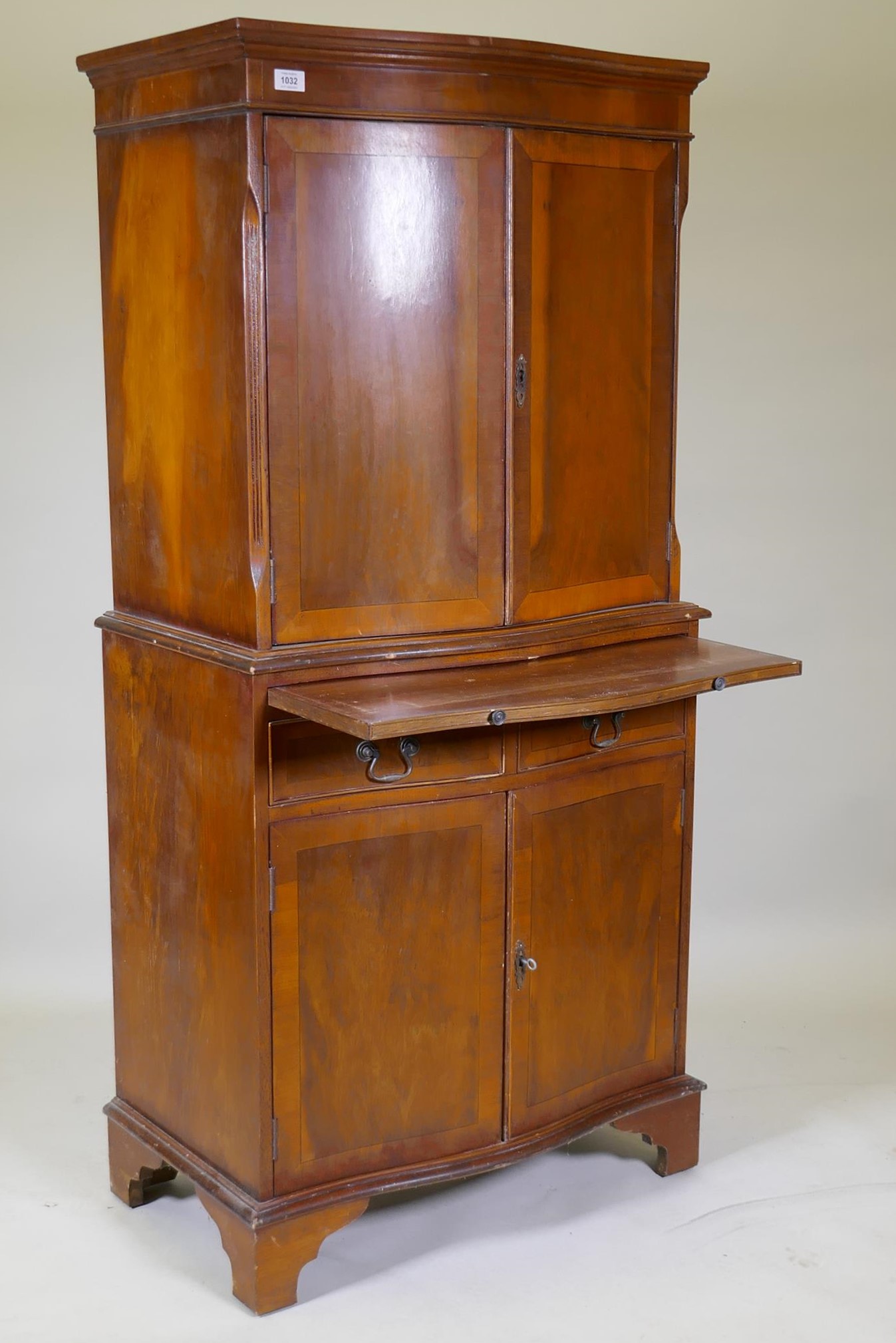A serpentine front yew wood cocktail cabinet, with two cupboards and mirror back interior, - Image 2 of 3