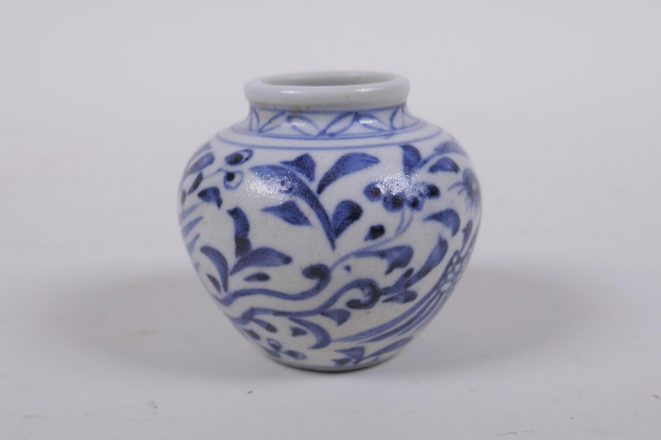 An early Chinese miniature blue and white porcelain pot with phoenix decoration, possibly Yuan - Image 4 of 5